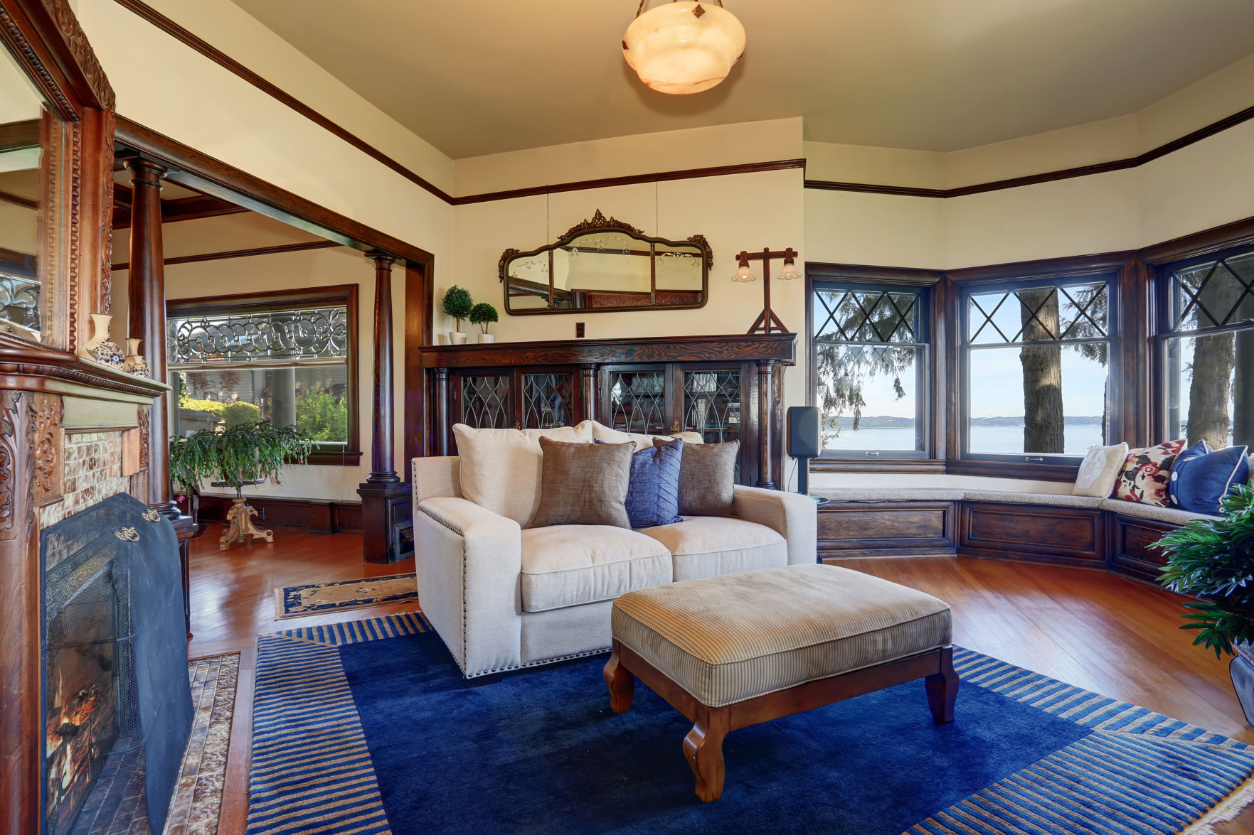 Vintage Style Living Room With Fireplace And Antique Wooden Cabinet.